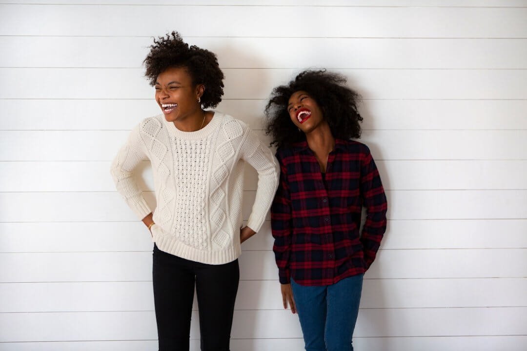 Two happy women after successful mental health therapy session