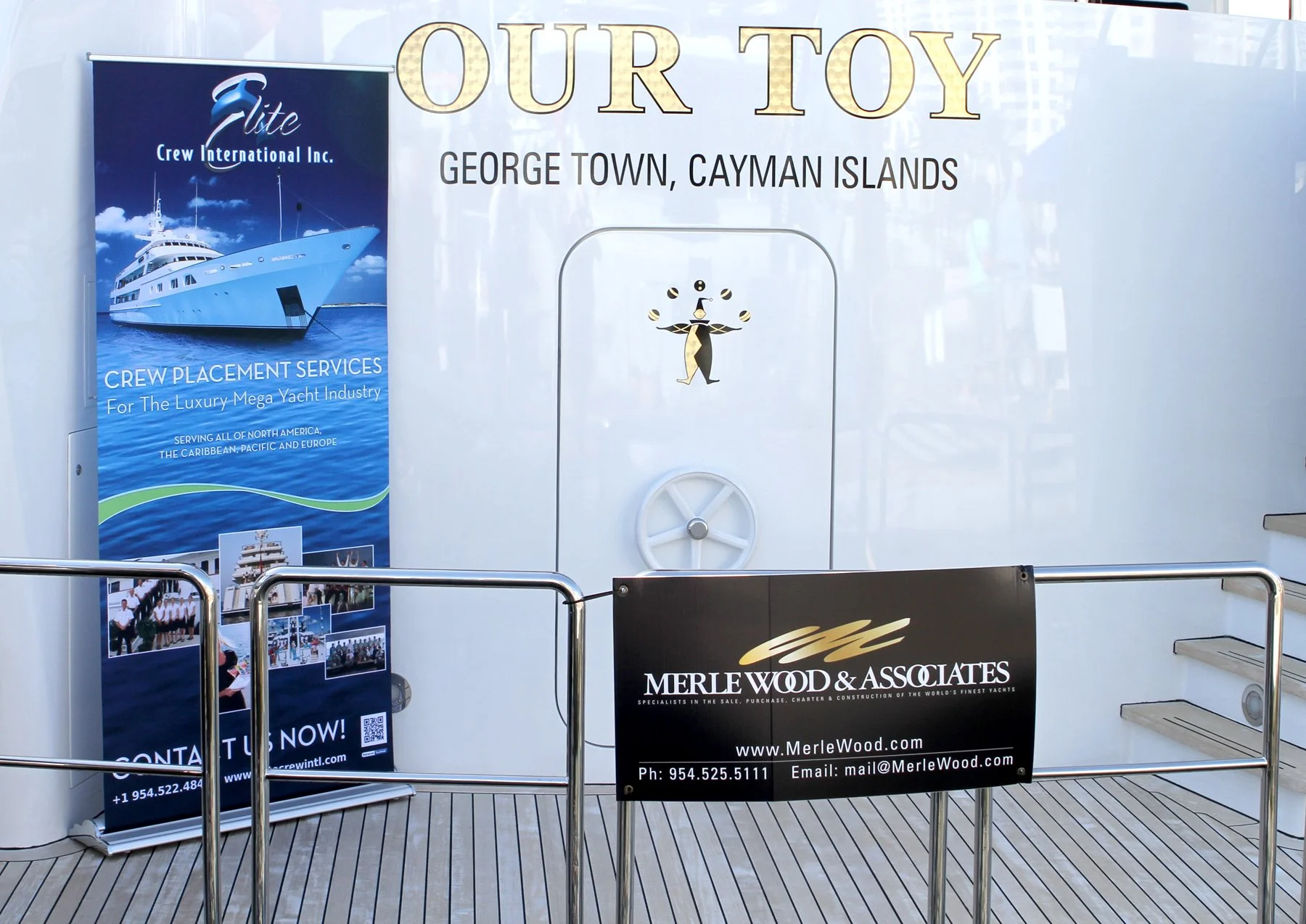Luxury yacht display and signage for Merle Wood & Associates and Elite Crew International in George Town, Cayman Islands.
