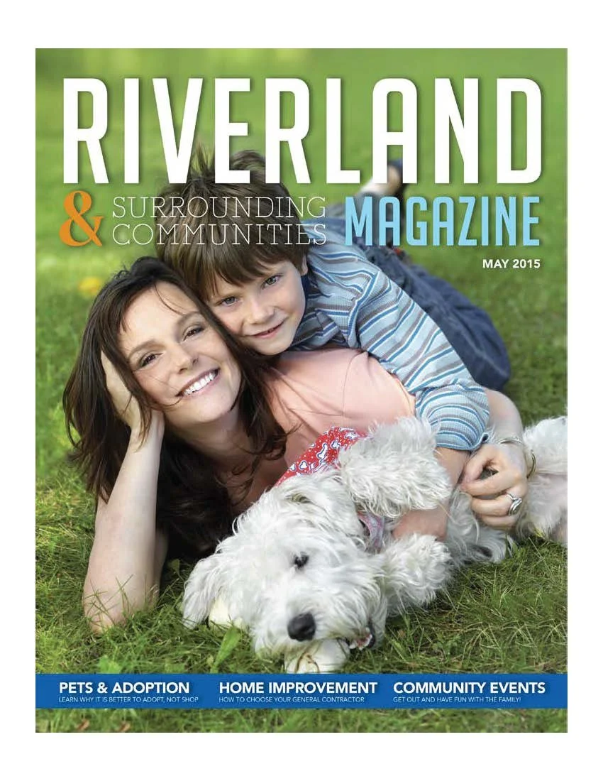 Cover of Riverland Magazine May 2015 with a woman, child, and dog laying on grass.