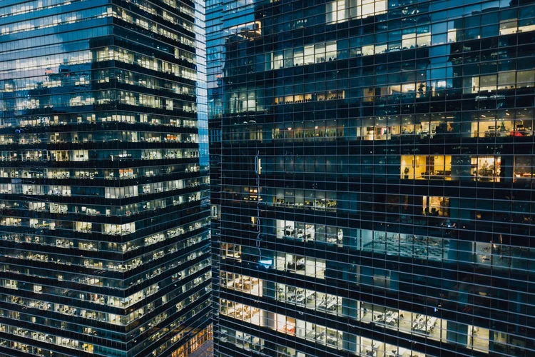 Modern buildings with illuminated windows at night