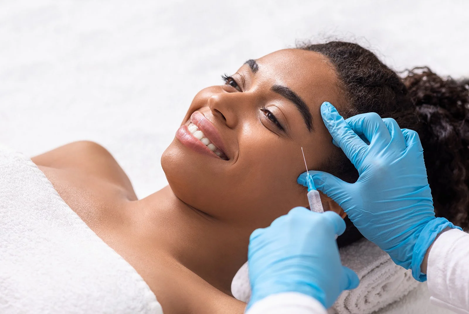 Black woman receiving injectable at her facial balancing appointment in St. Catharines