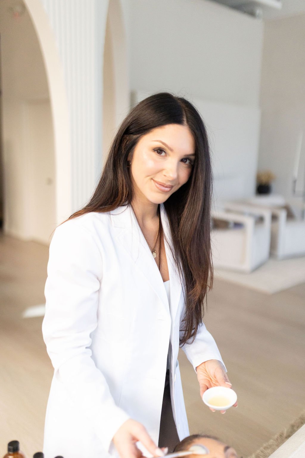 Licensed Nurse Practitioner Cassie Cimino prepares her client's skin for a microneedling treament in St. Catharines