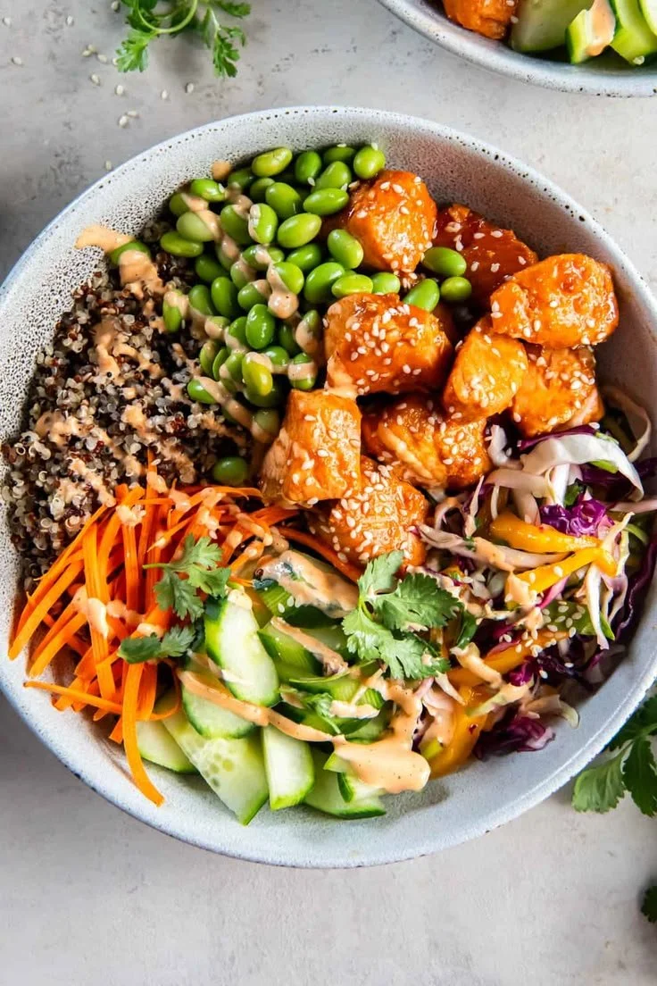 Delicious salmon quinoa bowls with mango slaw, edamame, cucumbers, cilantro and carrots_ It's great for meal prep and is full of fresh flavor!.jpg