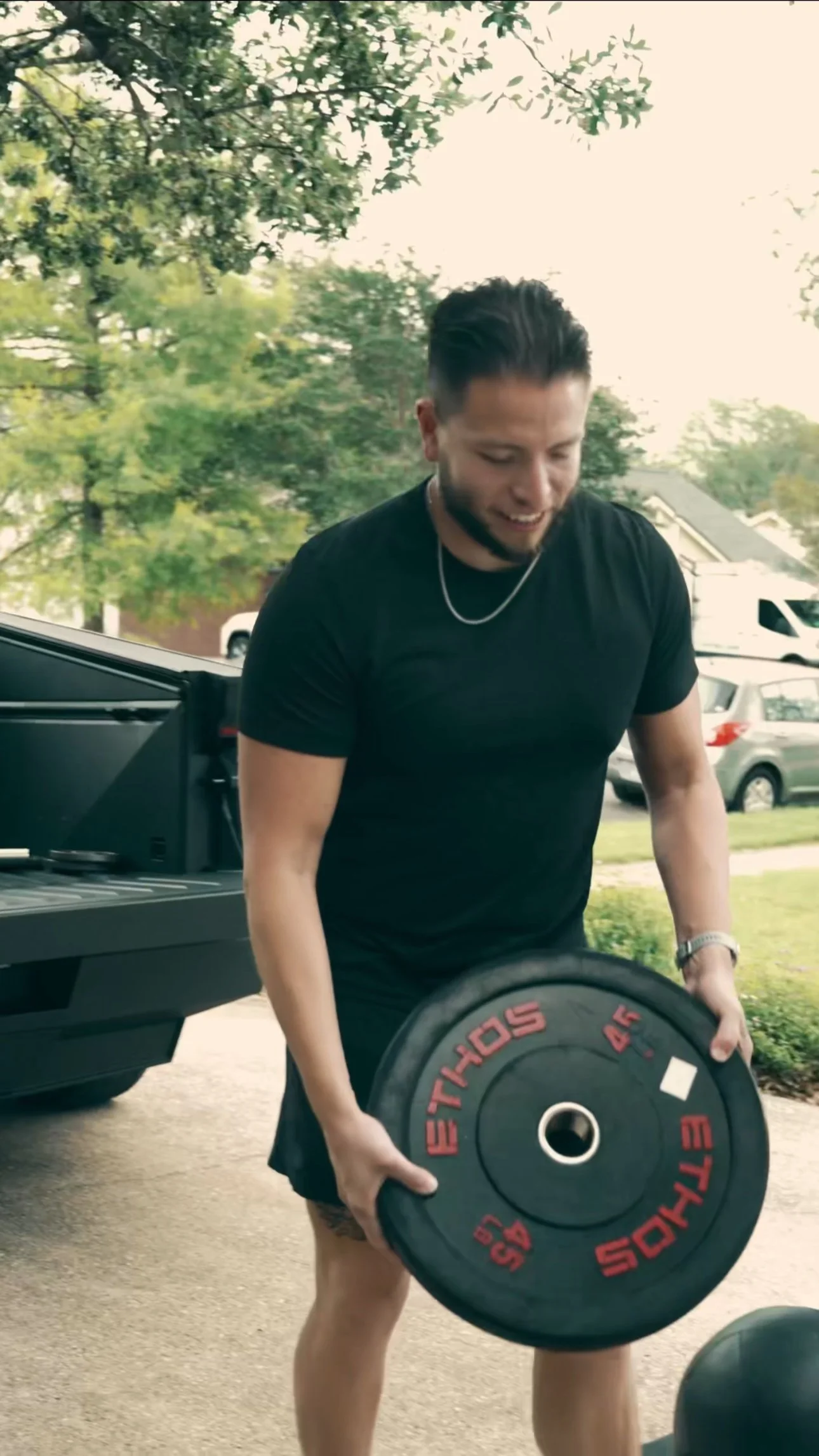 Joey Munoz of Orofit Mobile Training unloading strength equipment for a mobile personal training session in Austin, Texas.