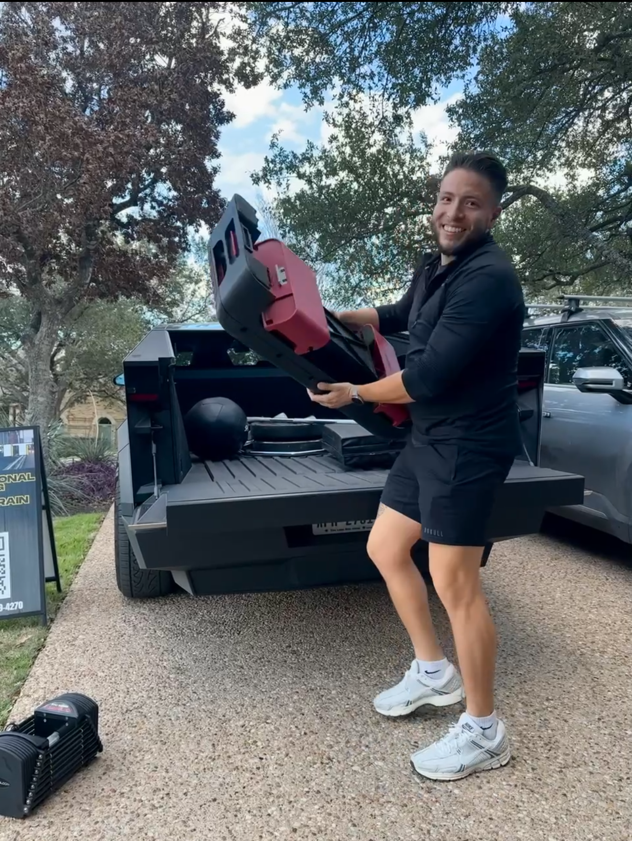 Mobile personal trainer setting up equipment for an outdoor training session in Austin Texas with Orofit Mobile Training.