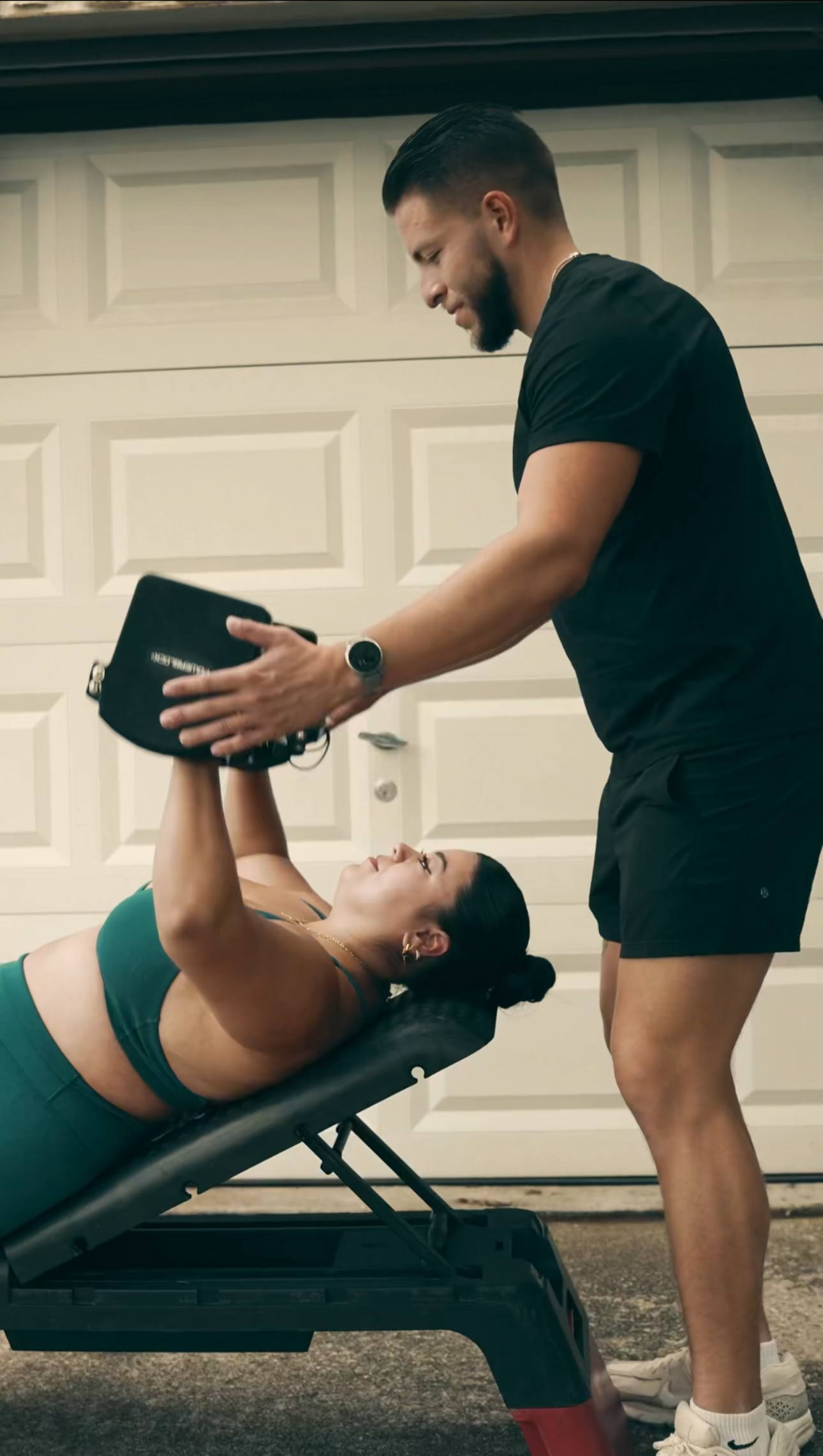 Joey Munoz of Orofit Mobile Training coaching a client during an in-home personal training session in Austin, Texas.