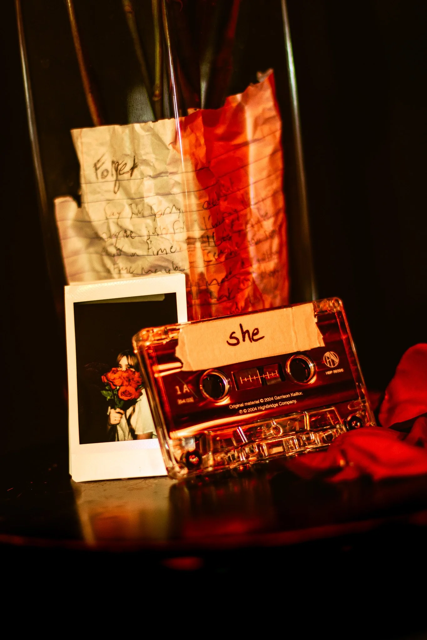 Vintage cassette tape with handwritten label on dark surface, surrounded by roses and a handwritten love note — DFW moody portrait photography by Capuchino Photography