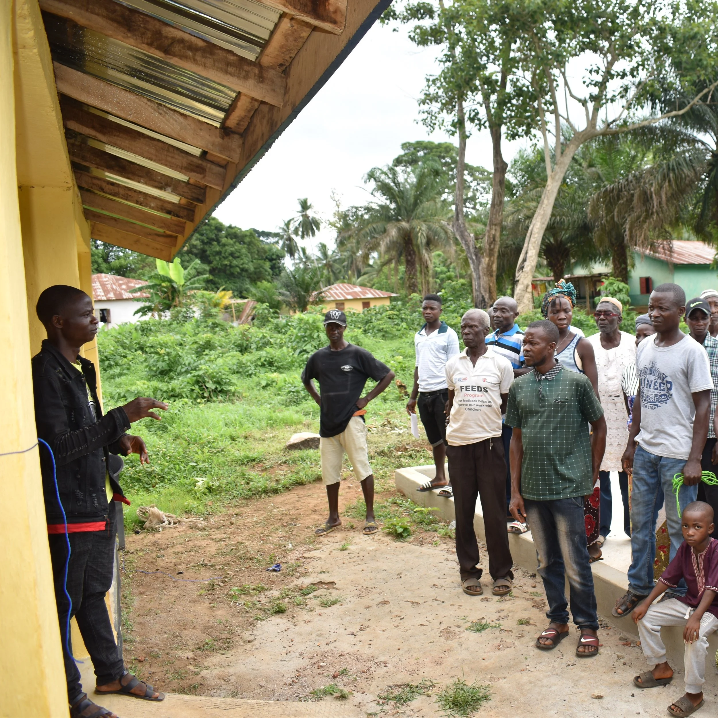 4-5-2022 Magbema ACT handover ceremomy, Philo telling the community members on the uses of the facilities.jpg
