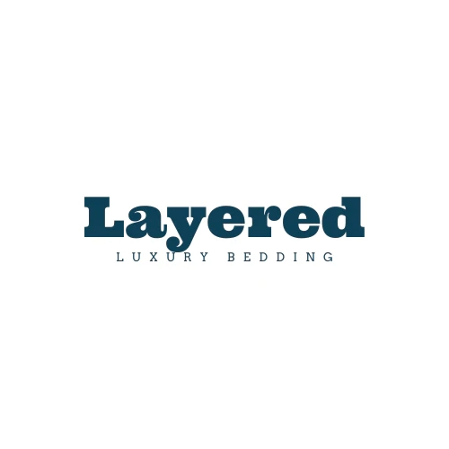 Logo reading 'Layered Luxury Bedding' in dark blue text on a white background.