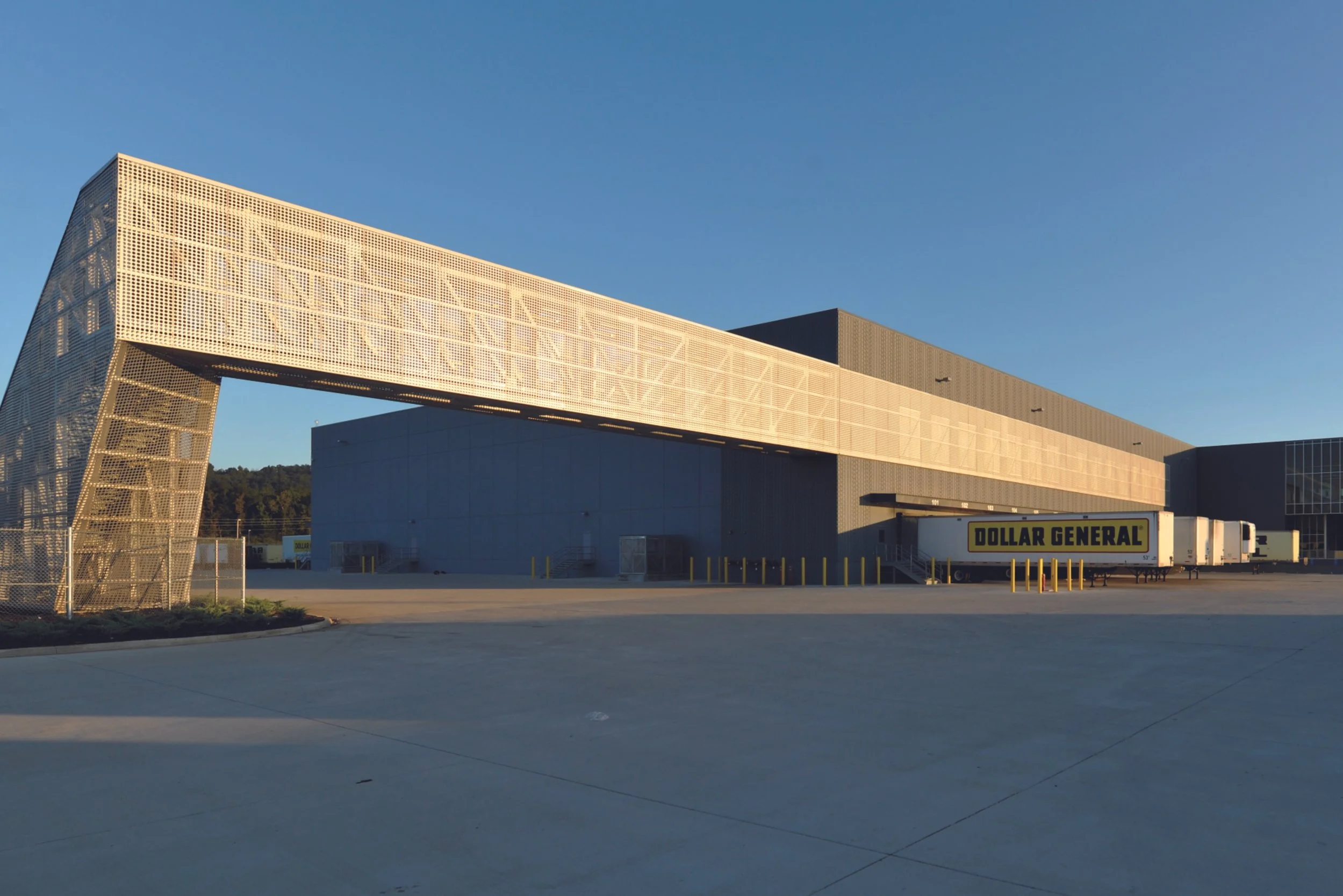 View of a distribution center with pedestrian walkway in the foreground.