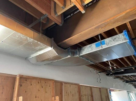 Duct work in building with tight floor-to-floor space