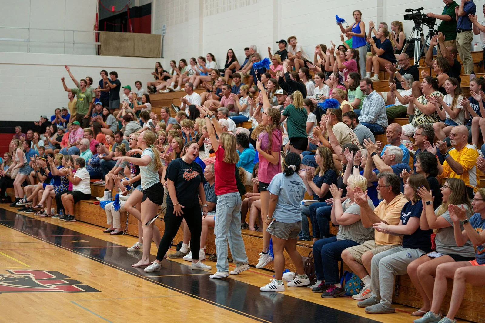 The crowd cheers for Carroll Community College's Women's Volleyball squad