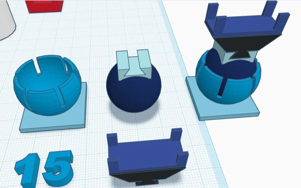 A 3D-printed ball and socket joint holding a phone stand