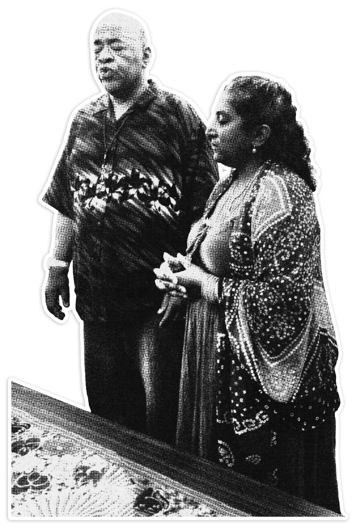 A black and white photo of a man and a woman standing inside a room, next to a patterned rug on the floor.