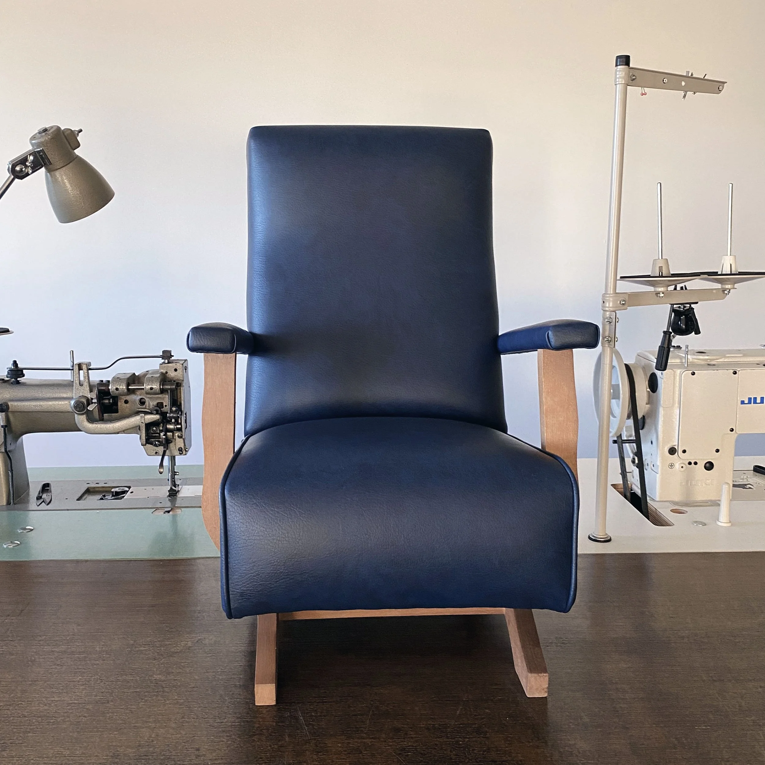 vintage children's rocking chair reupholstered in navy blue vinyl