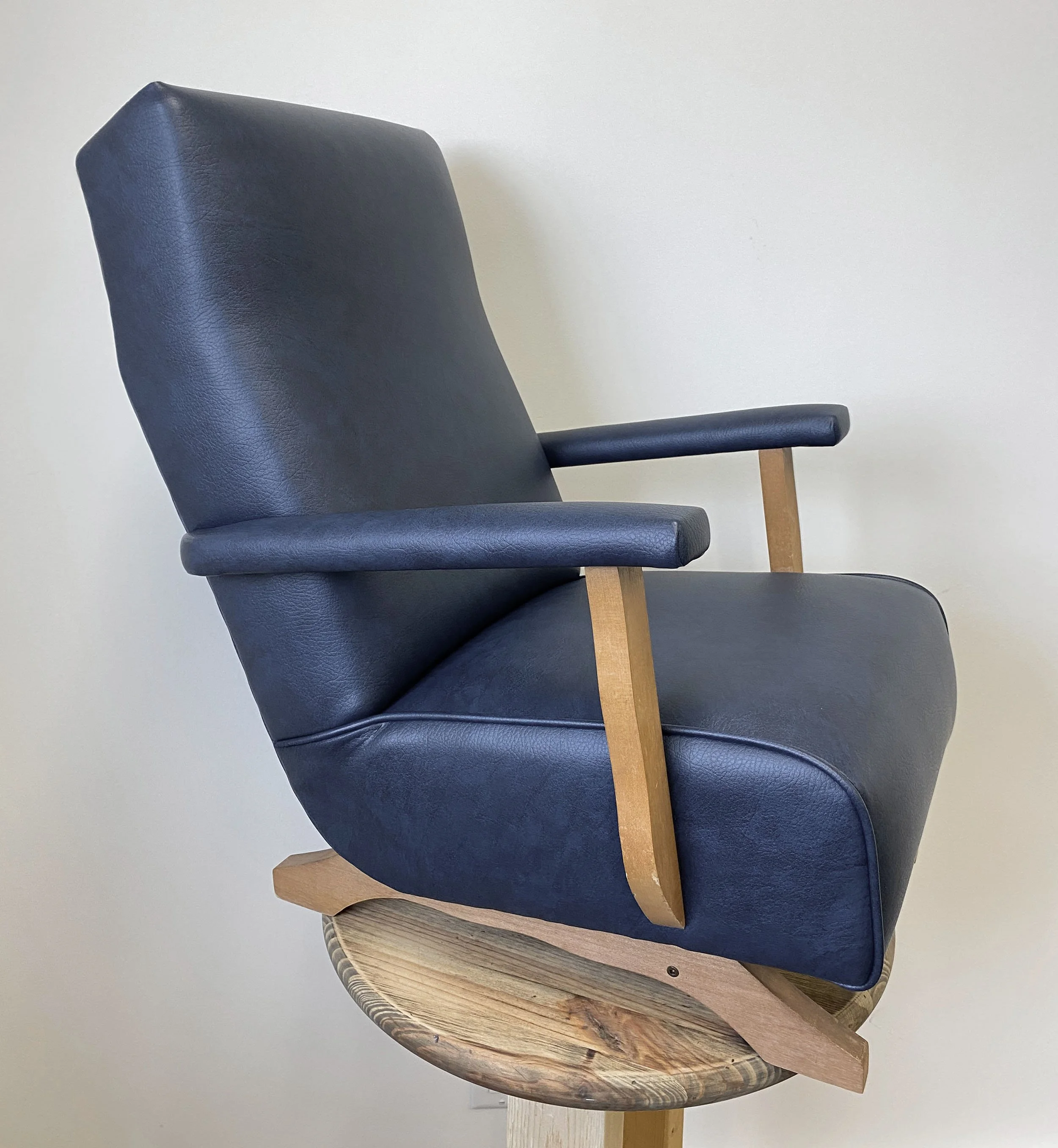 vintage children's rocking chair reupholstered in navy blue vinyl- side view