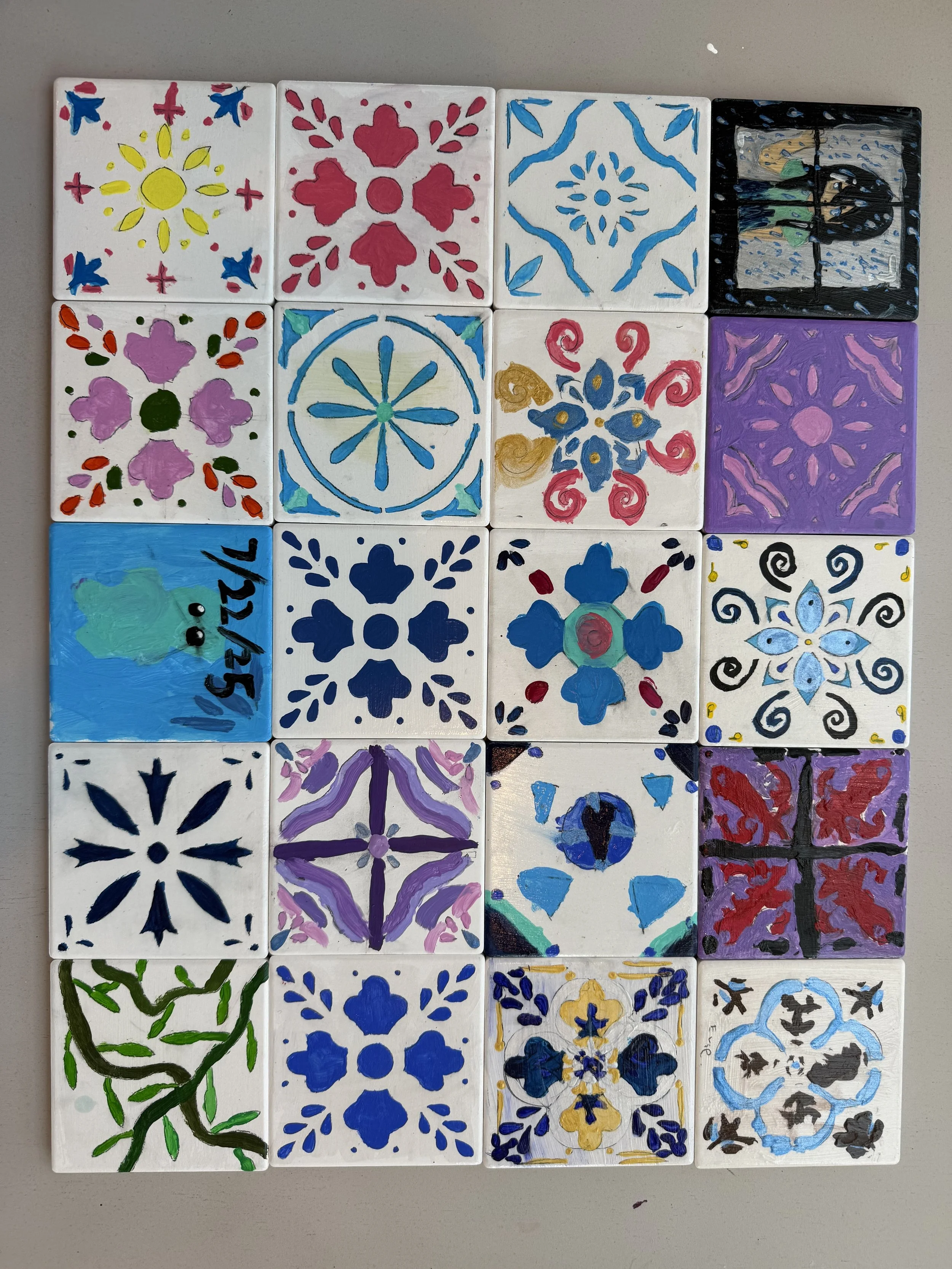 child painted ceramic tiles at an art camp in loudoun county virginia