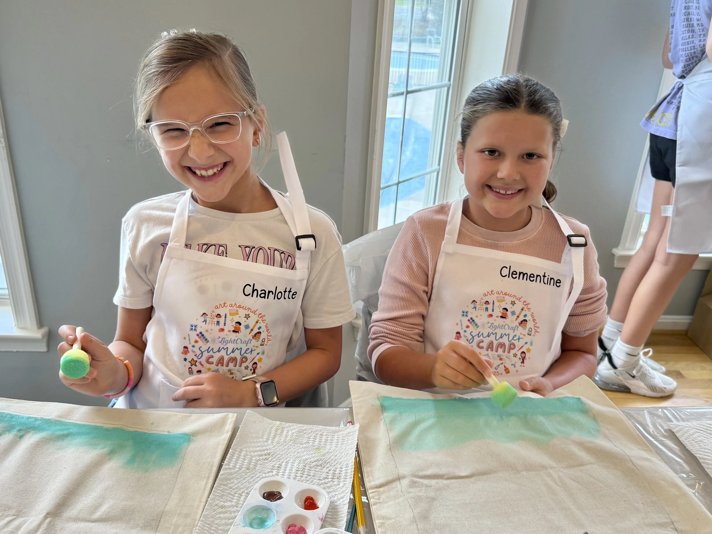 Kids painting during a creative enrichment class in Ashburn.