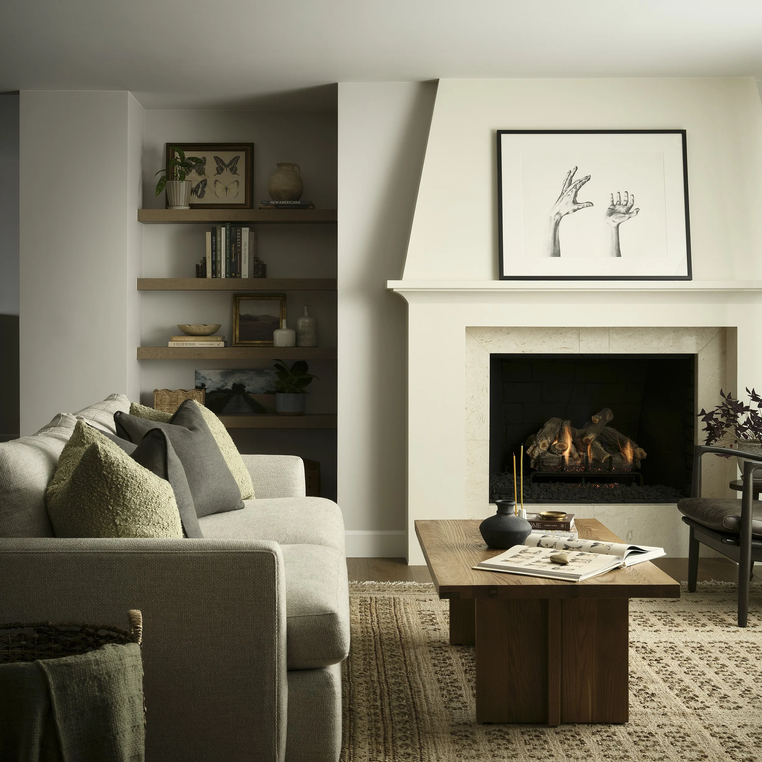 Neutral living room with custom fireplace surround and warm layered textures in Denver remodel