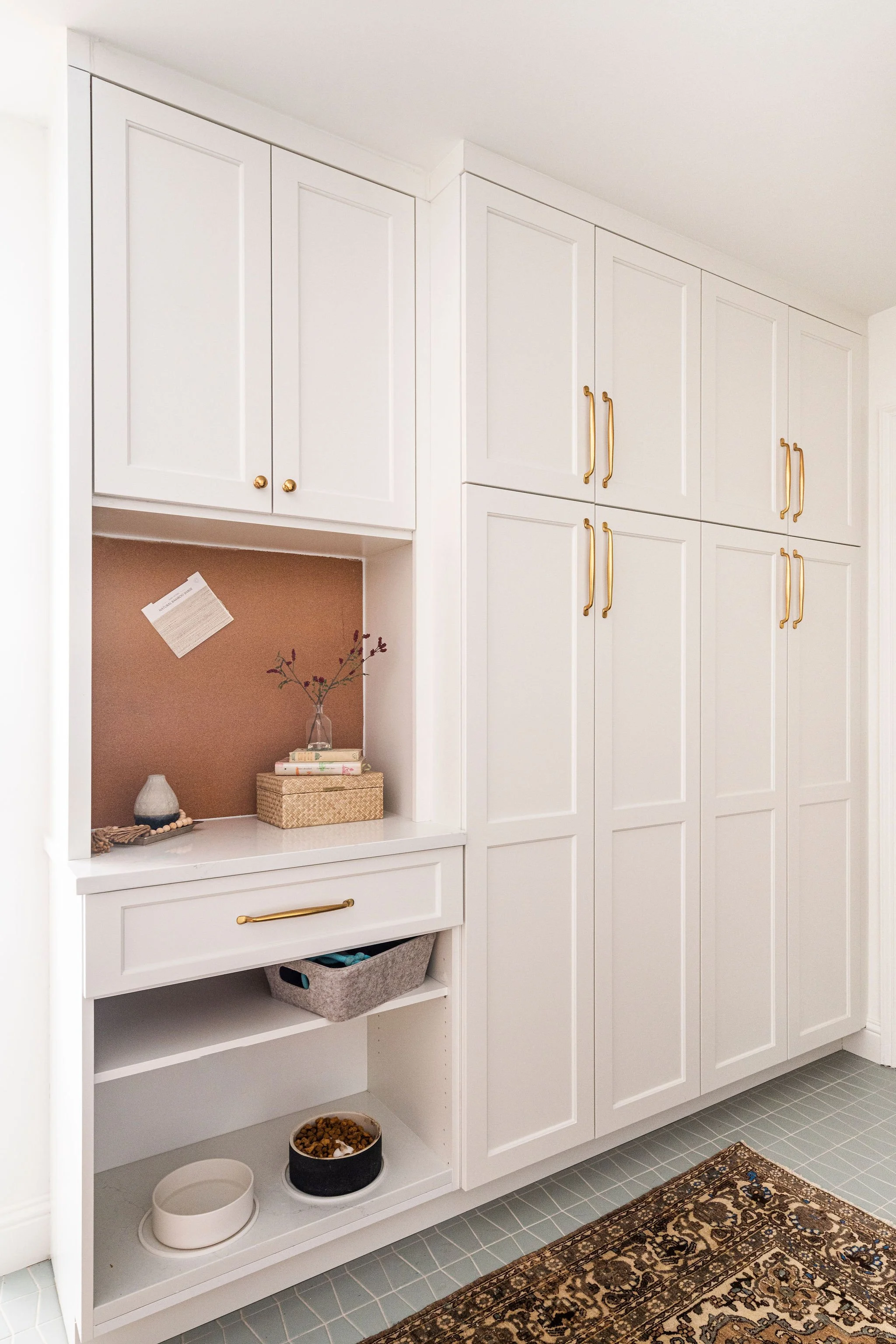 mudroom with pantry cabinets & light blue floor tile