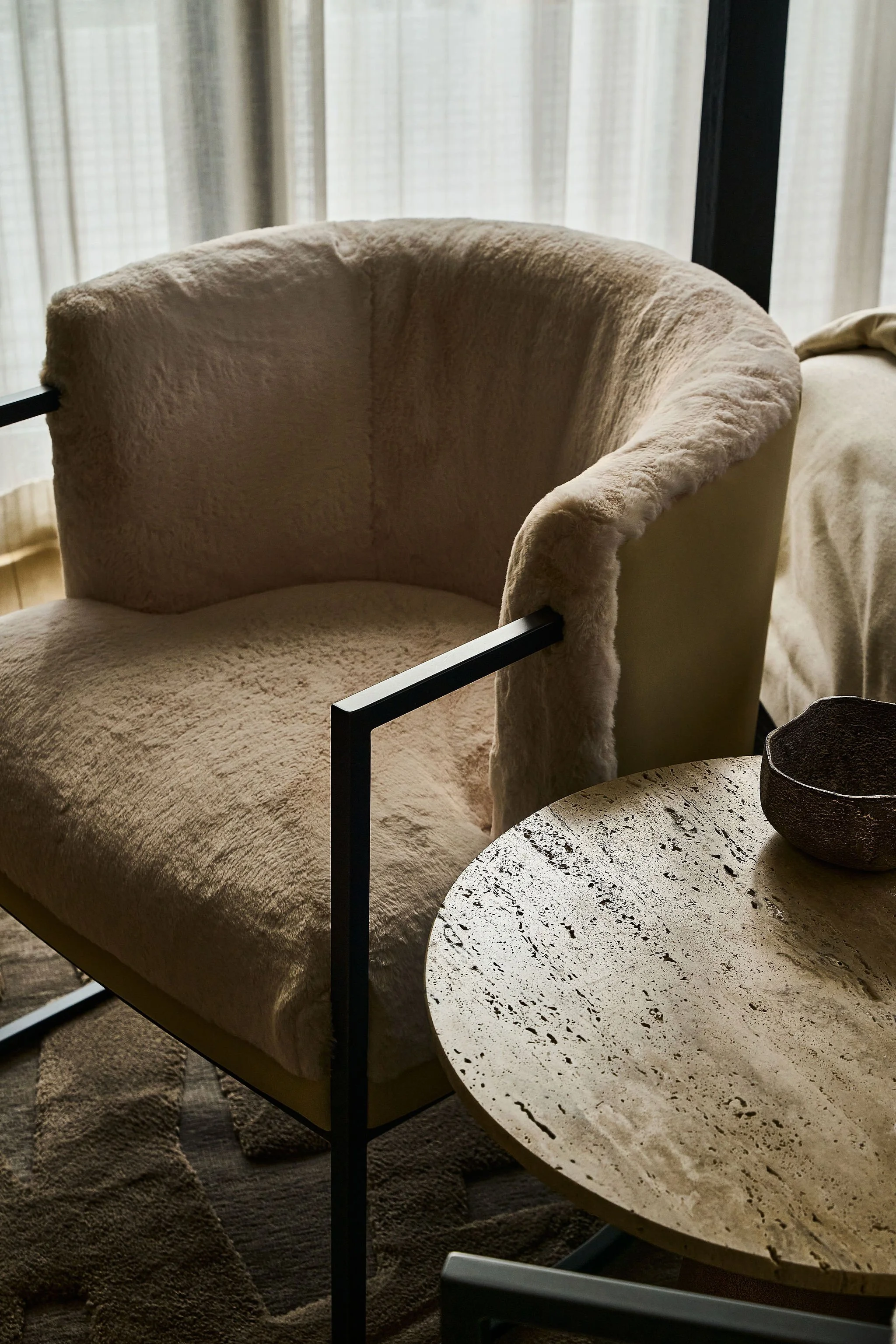 fur accent chair with stone side table
