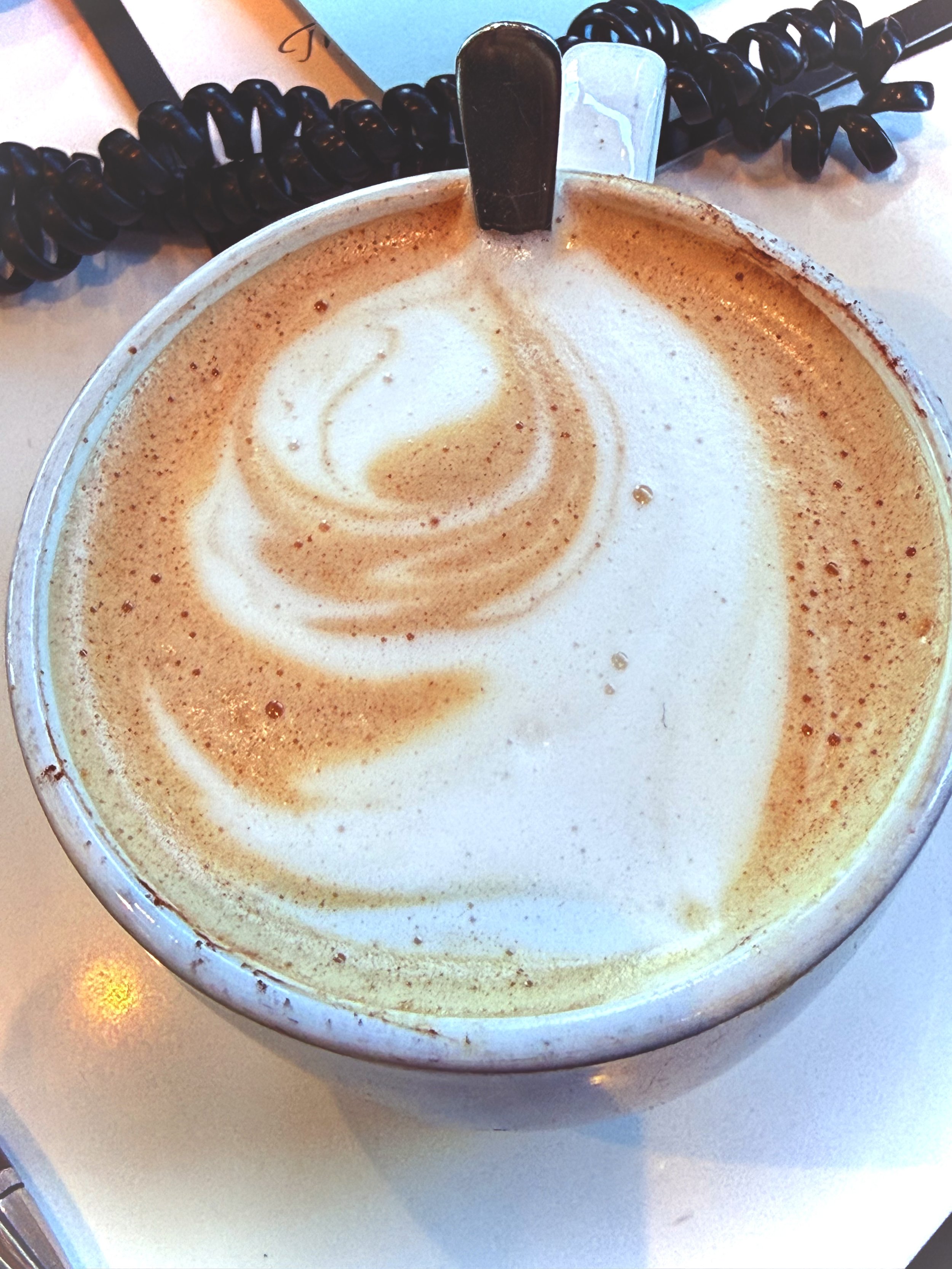 Bastet revealed herself in silence, in the swirl of  the foam quietly blessing my morning. 