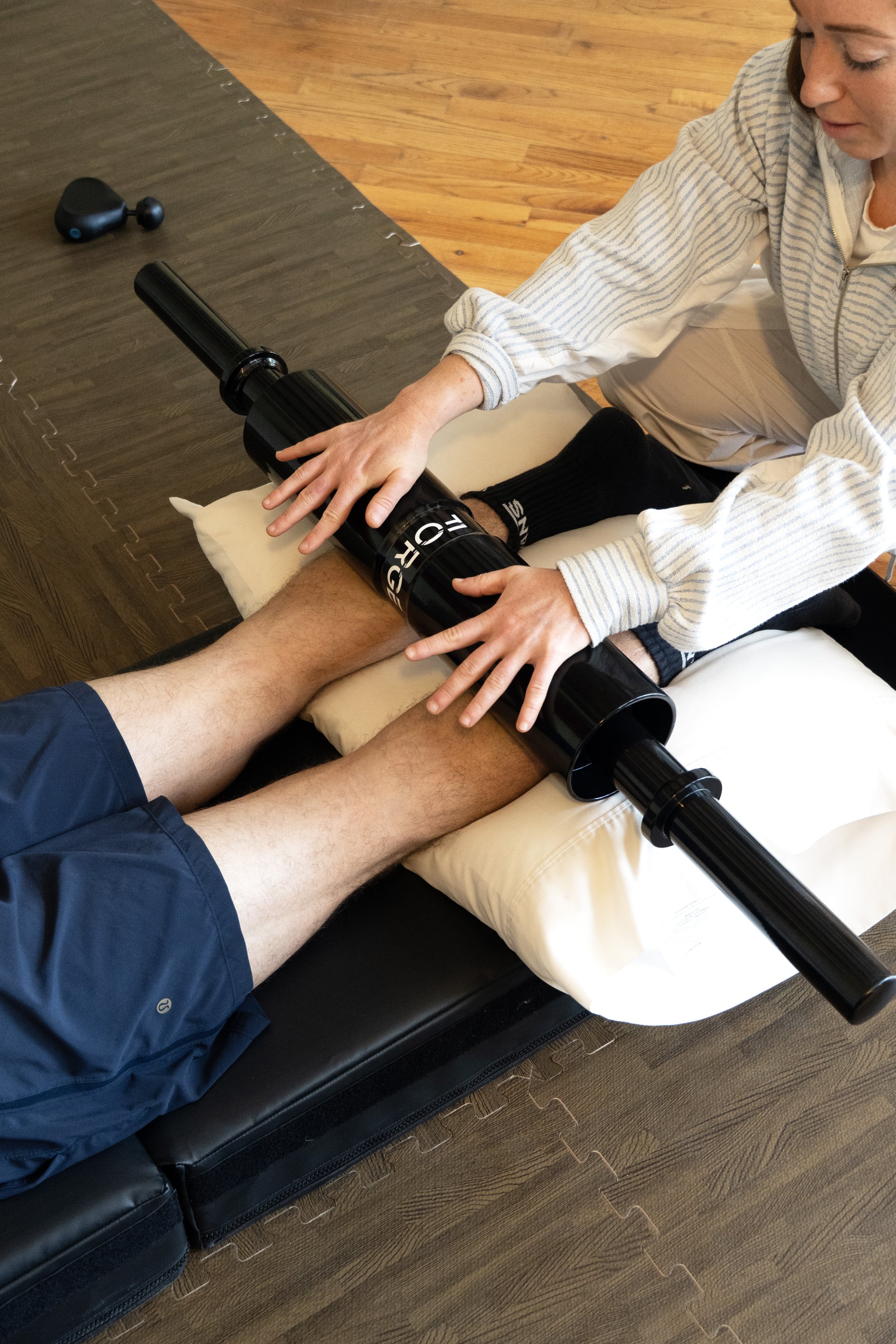Assisted stretching, mobility work, injury prevention, and injury rehabilitation during a sports therapy session at Vibe Sports Recovery in Stowe, VT