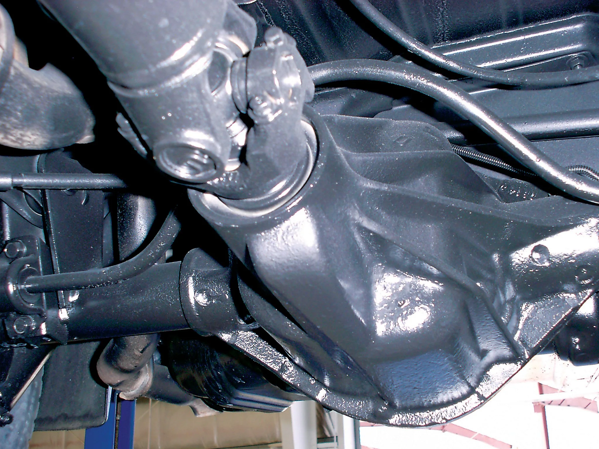 Close-up of the underside of a vehicle after treatment with Waxoyl.