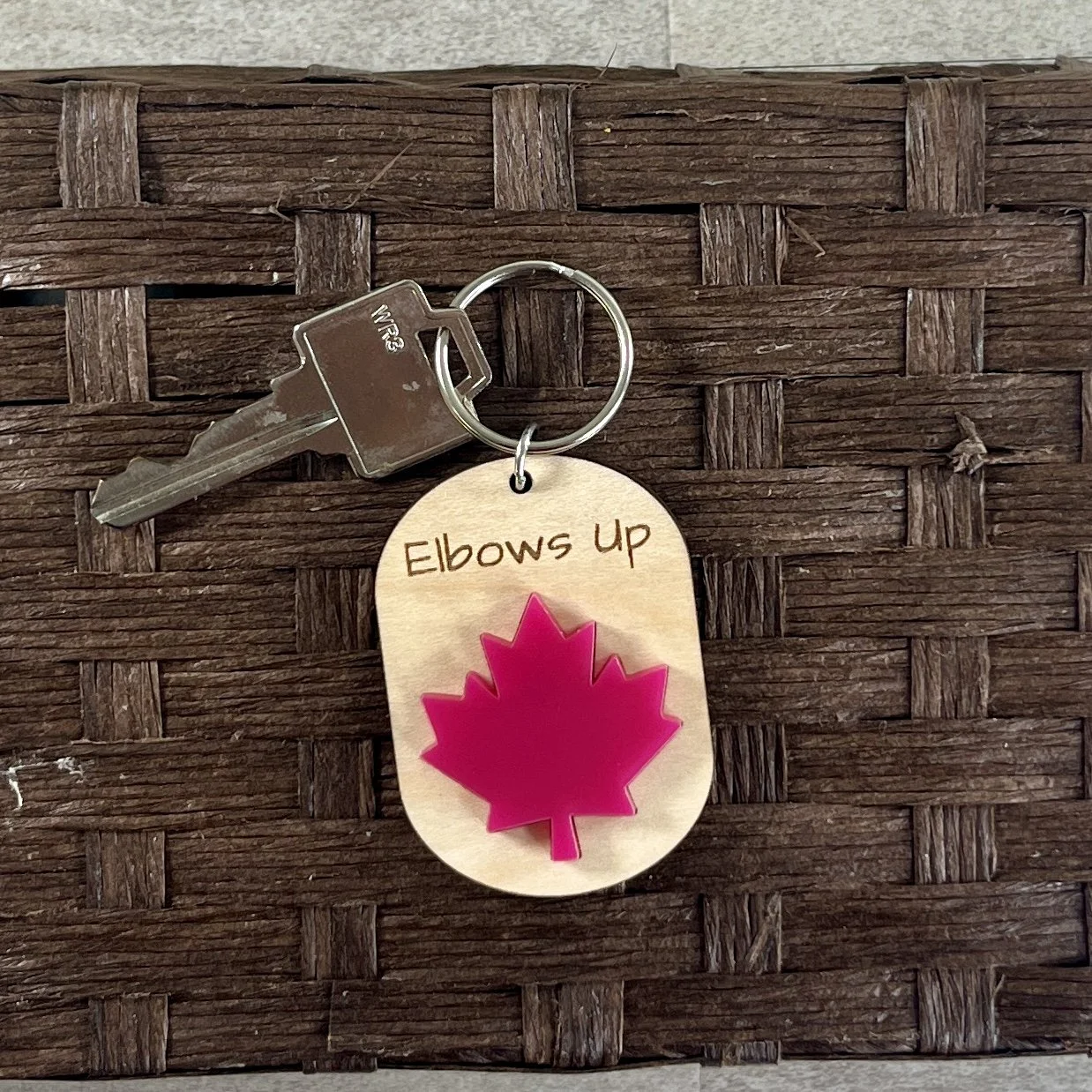 hero shot canadian maple leaf wood keychain matte red acrylic proud Canadian gift.