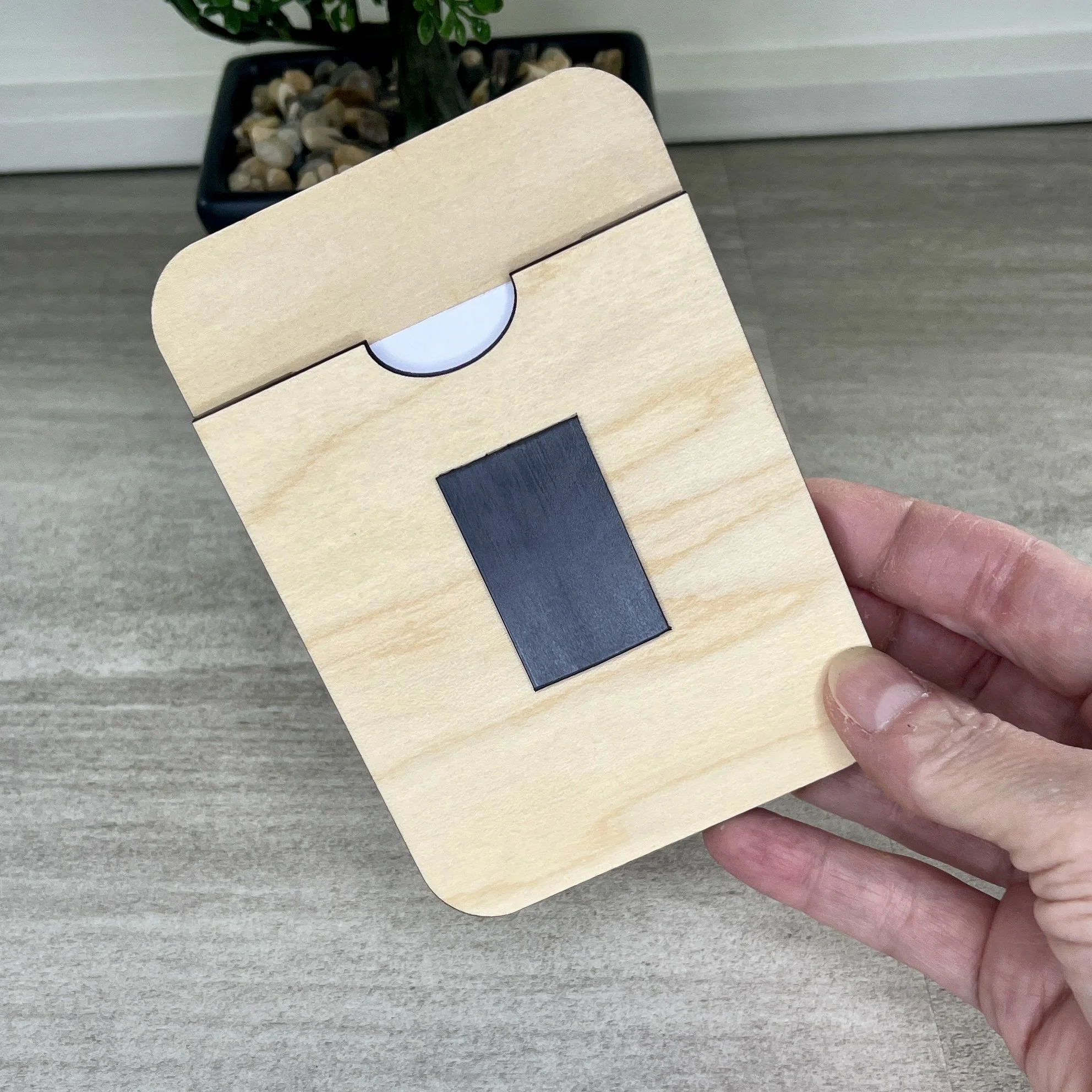 rear view maple wood photo frame magnet showing photo slot and magnet.