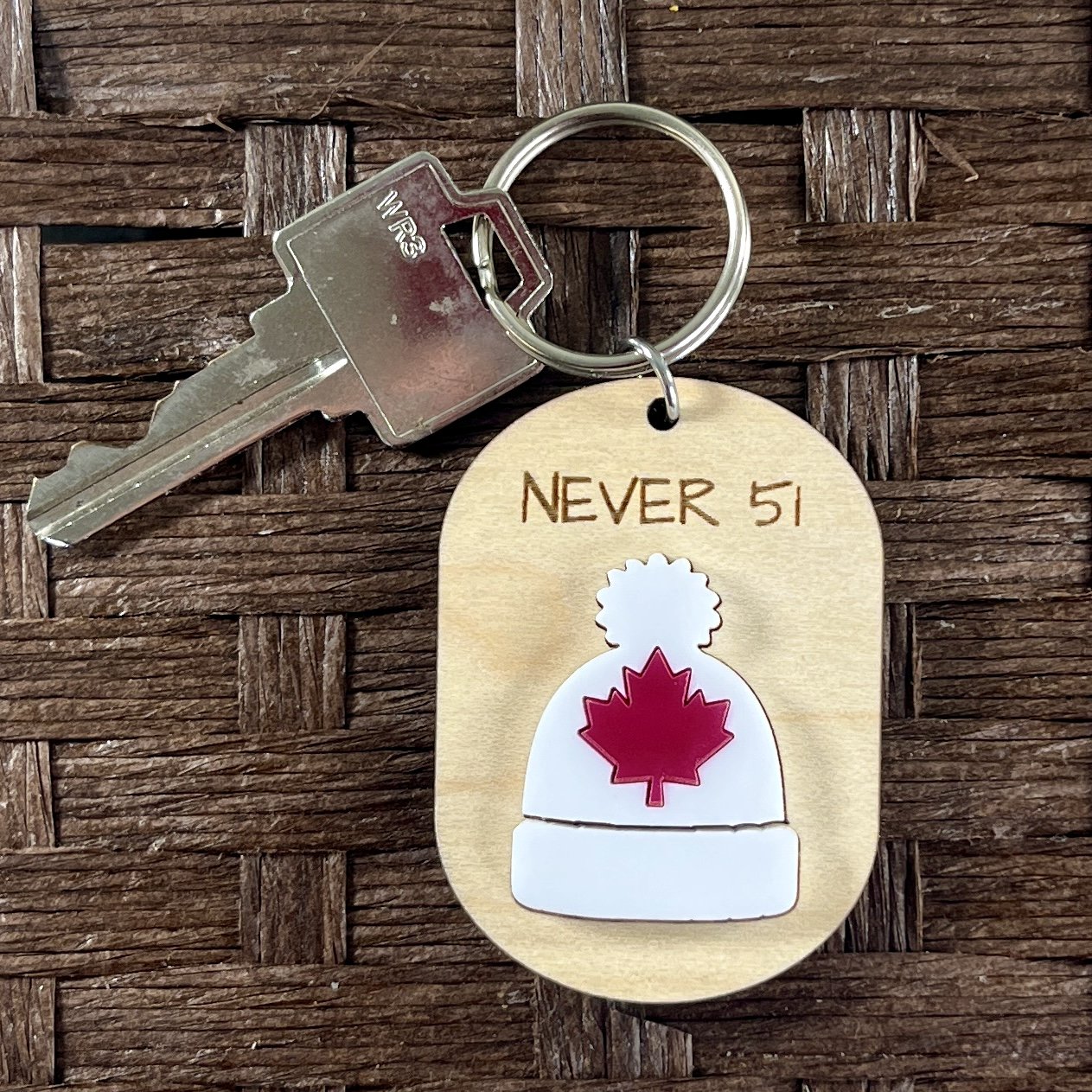 hero shot canadian toque wood keychain matte white acrylic proud Canadian gift.
