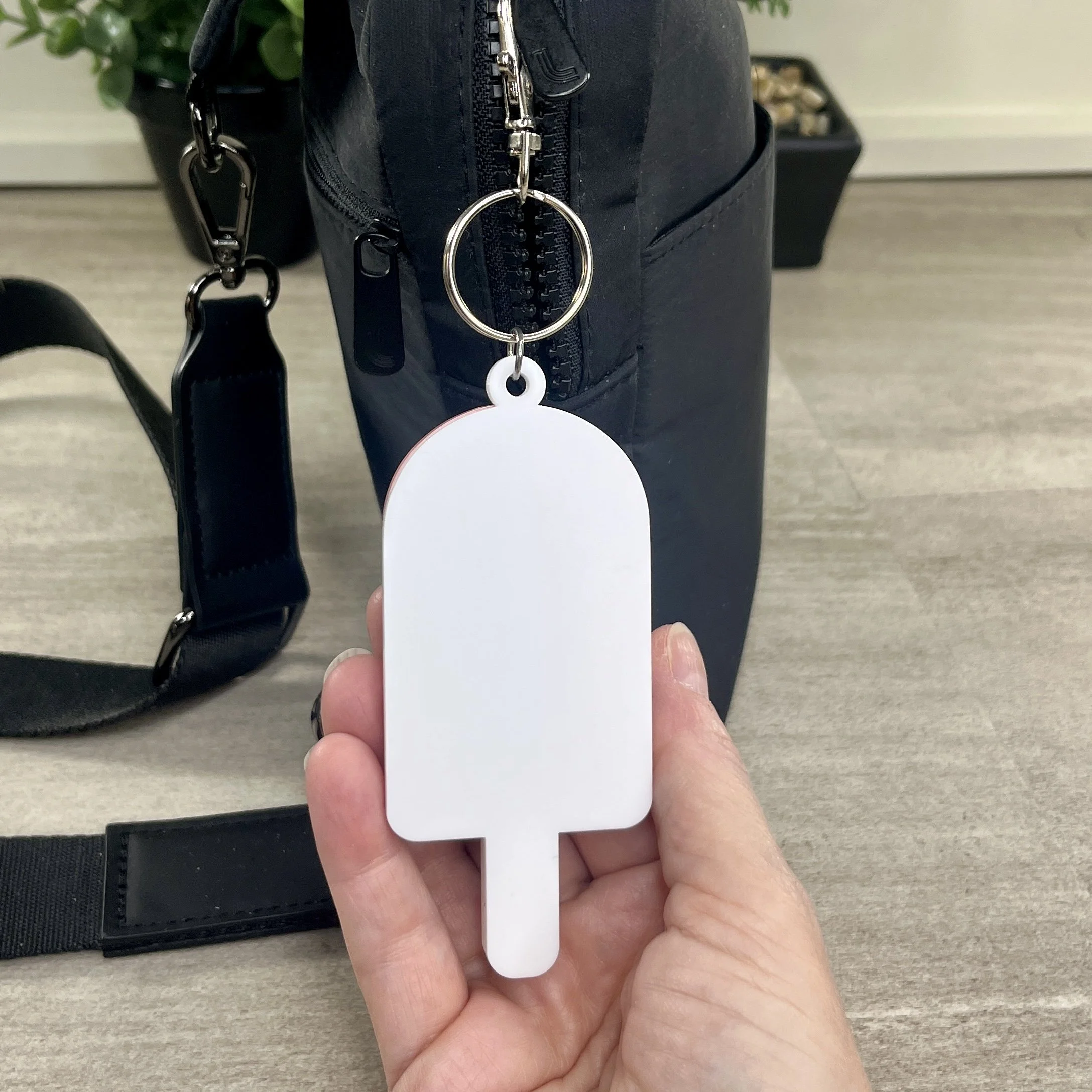 Rear view of popsicle-shaped acrylic backpack tag.