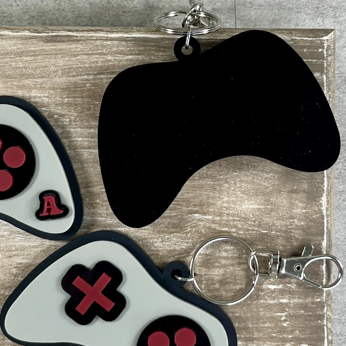 Rear view of game controller-shaped acrylic backpack tag.
