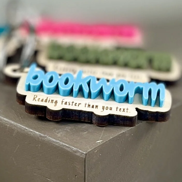 angle view laser cut maple wood keychains multiple acrylic colours bookworm quote book lover gift.