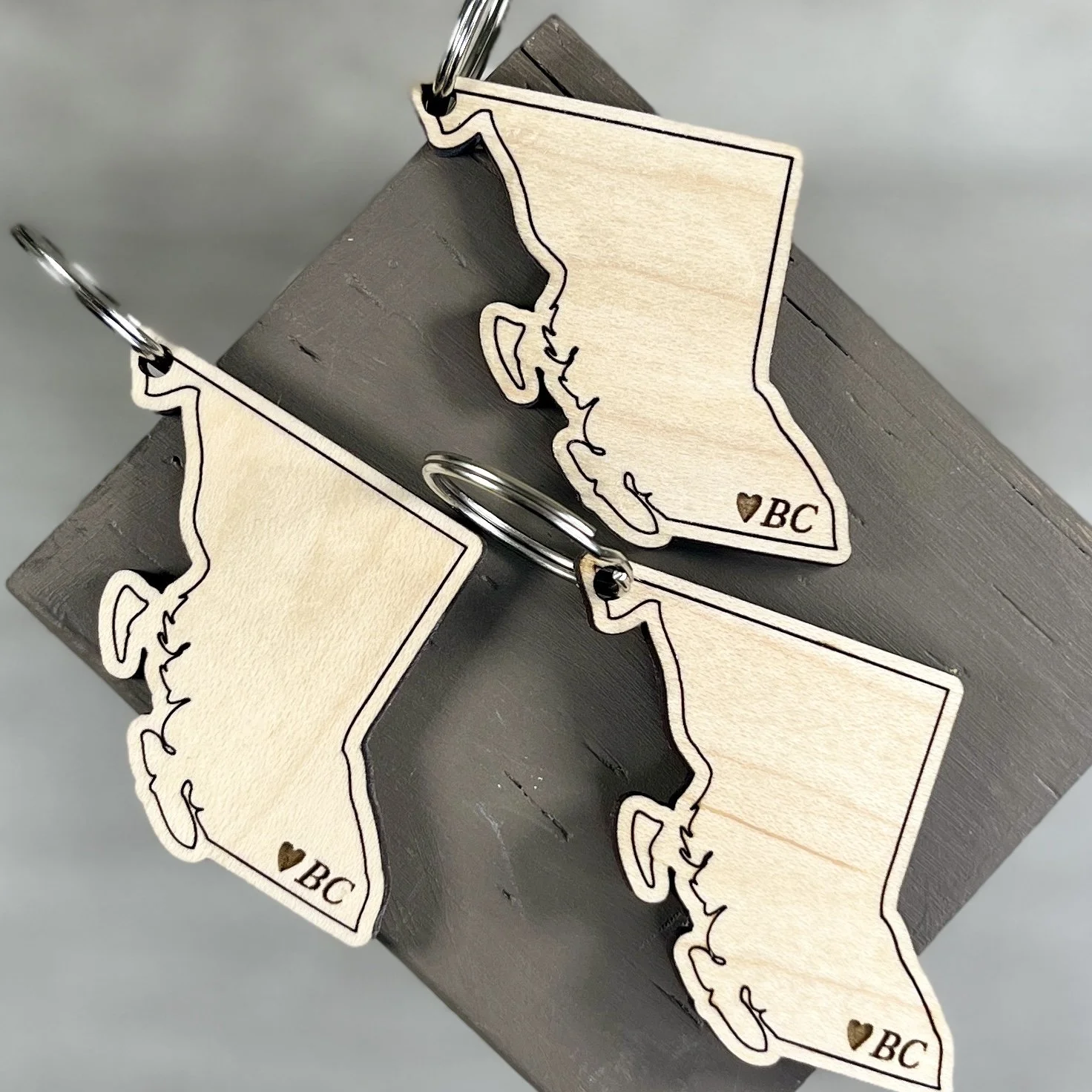 flat lay wood keychain Province of British Columbia Canada