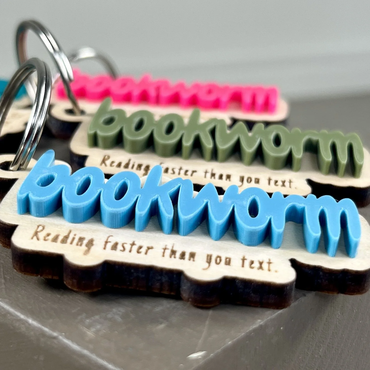angle close up laser cut maple wood keychains multiple acrylic colours bookworm quote book lover gift.