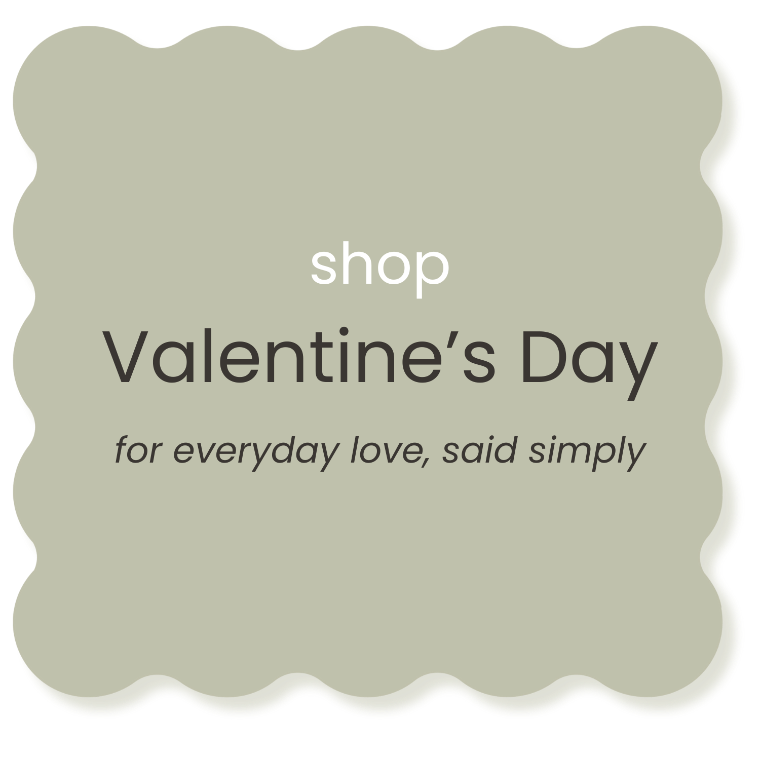 A beige decorative sign with scalloped edges promoting Valentine's Day shopping, with the message 'shop Valentine's Day for everyday love, said simply'.