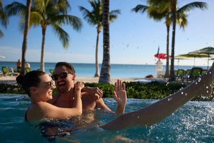 🌴☀️ Experience your Perfect Day at Coco Cay! Dive into the extravagant Coco Cay Beach Club Infinity Pool, where lounging and relaxing go hand in hand with soaking up the sun. Enjoy swimming, tanning, and making unforgettable memories in this tropica