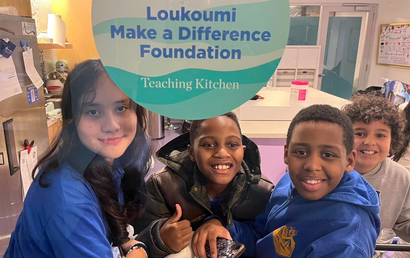 Kids from the Variety Boys & Girls Club of Queens pose in the Chef Maria Loi Loukoumi Make a Difference Teaching Kitchen at The Floating Hospital