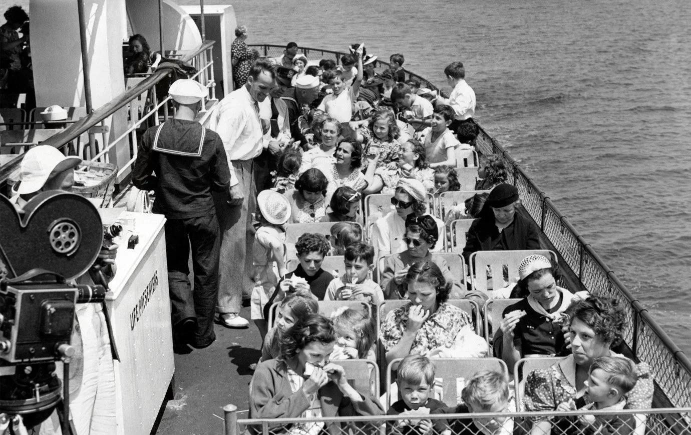 “Supplied with milk and sandwiches, mothers and children eat under the sun on the deck of the Floating Hospital. Besides enjoying the fresh breezes of the harbor, the one day tourists were treated to an entertainment program headed by Ireene Wicker*, the “Singing Lady” of radio.” The Pittsburgh Press, July 23, 1939.