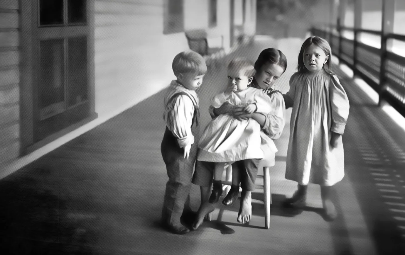 A "little father" and siblings on the verandah at Seaside Hospital.
