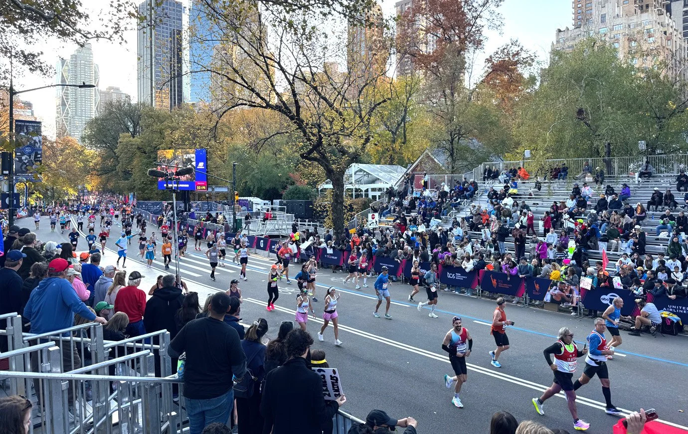 NYC Marathon runners approaching the finish line.