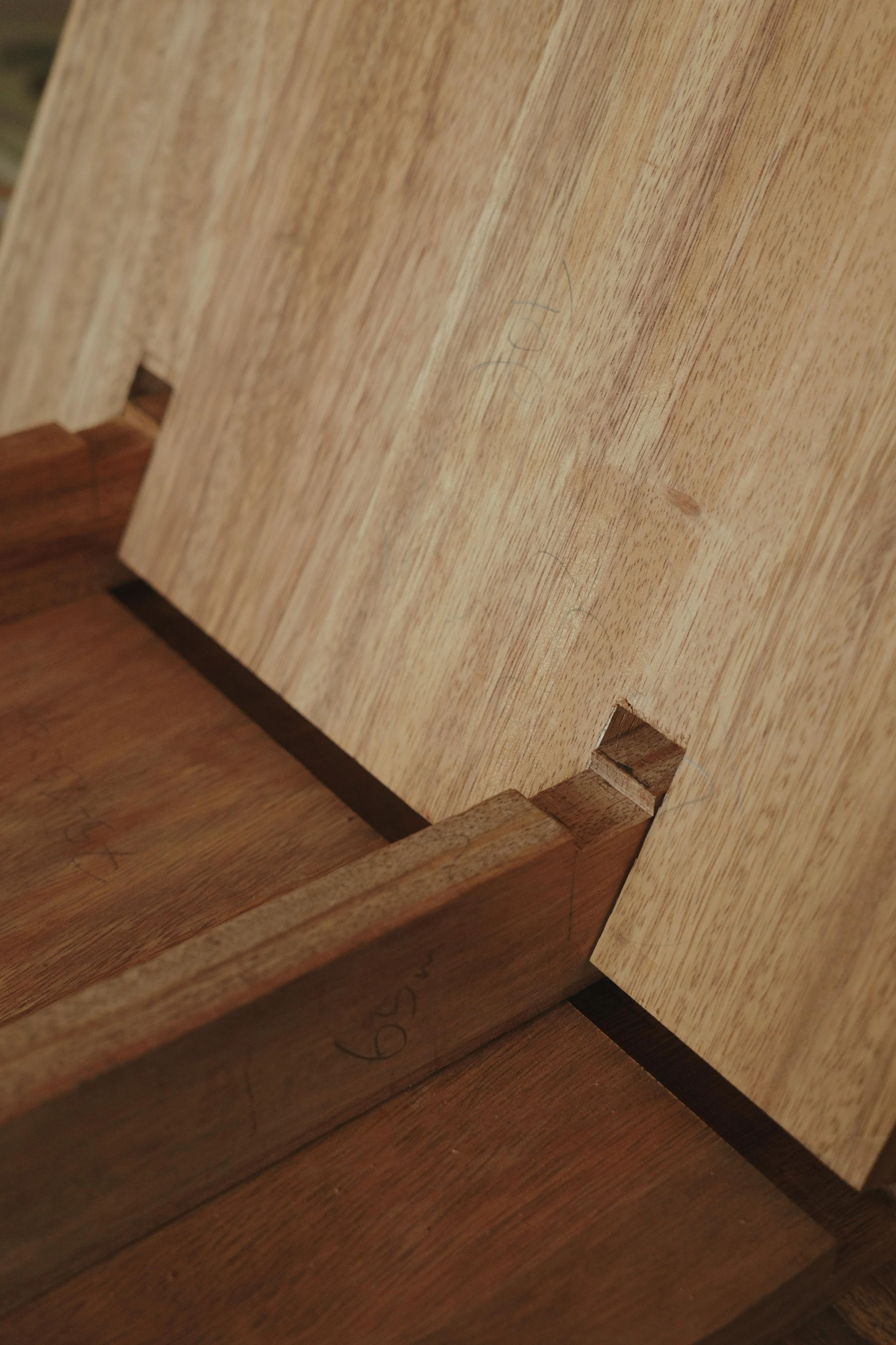 Close-up of fine joinery in exotic hardwood during a ManMade woodworking workshop