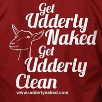 Red shirt with the text 'Get Udderly Naked Get Udderly Clean' and a simple line drawing of a goat head.
