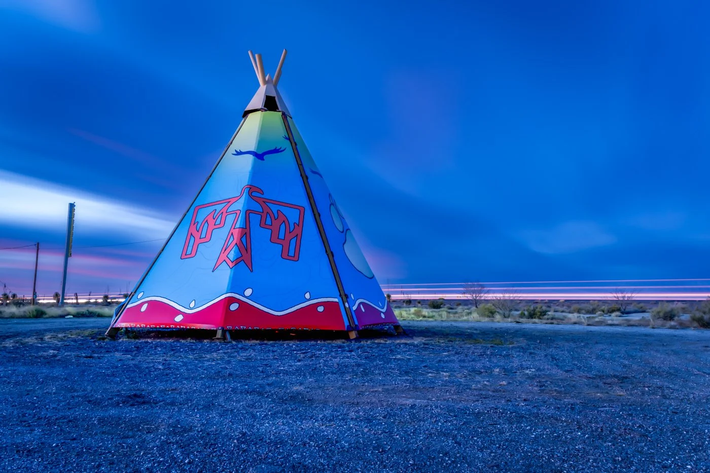 Teepee with traffic light trails in the background