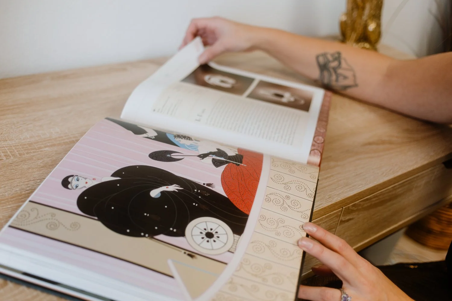 Stacey flipping through an Art Deco book