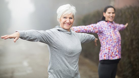 Neuromuscular Disease Women Stretching Outside.jpeg