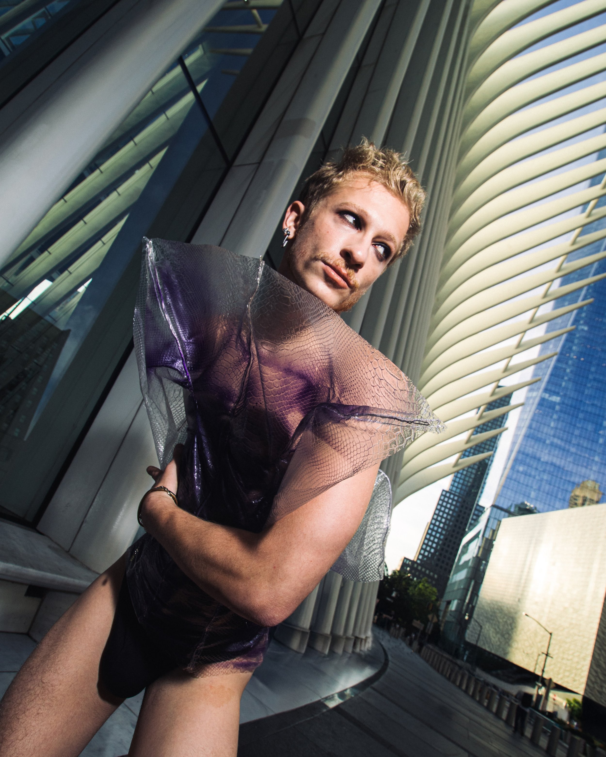Photo of Griffin Maxwell Brooks in front of a cathedral wearing Benjamin Medina's designs