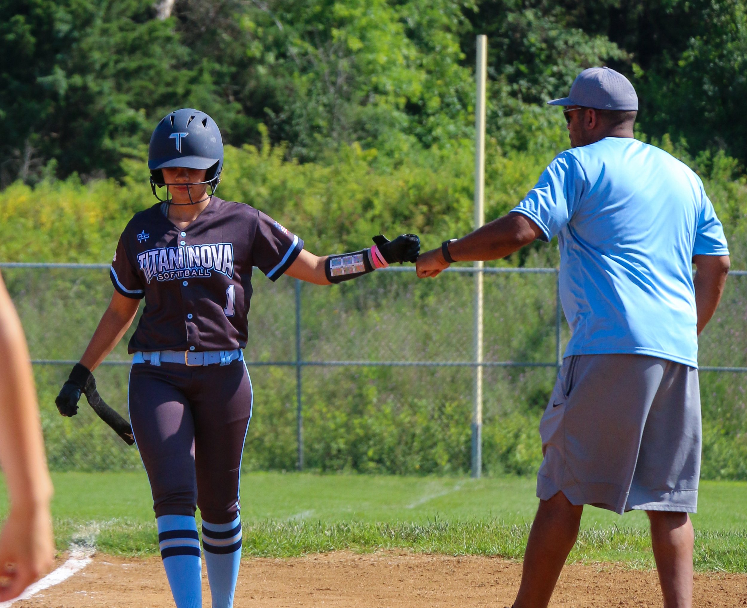 Titan NOVA softball player and coach