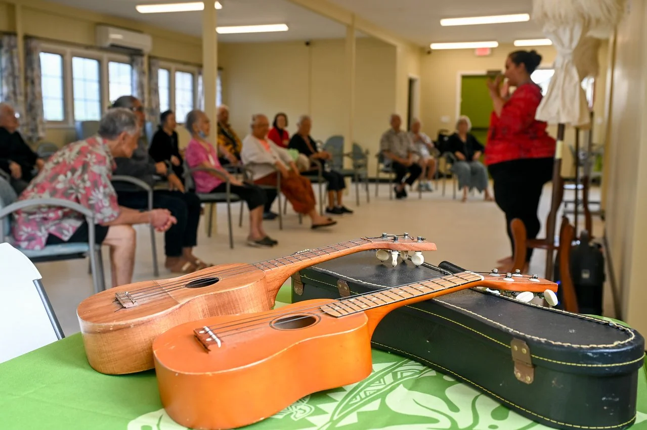ukuleles laid upon its case for a music activity within the Lunalilo Home